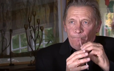 Peter Bastian plays a straw